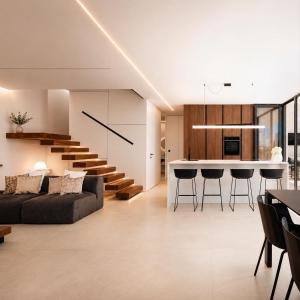 a living room and kitchen with a couch and a table at Villa9eleven in Novigrad Istria
