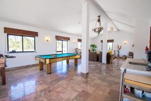 a living room with a pool table in it at Ufitness Villa Algarve in Vila Real de Santo António
