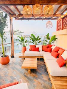 a living room with couches and potted plants at NH Royal Urban Cartagena in Cartagena de Indias