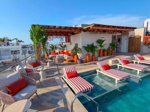 a hotel patio with chairs and a swimming pool at NH Royal Urban Cartagena in Cartagena de Indias
