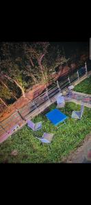 a group of chairs sitting in the grass at DREAM LAND cottage in Abbottabad