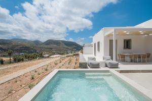 a view of a house with a swimming pool at Villa Serenity Complex in Kampos Paros