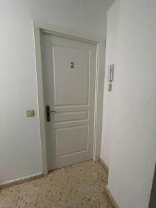 a white door with the number two written on it at Sanpau in Vejer de la Frontera +10 photos