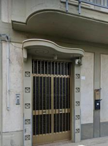 a door with a metal gate on a building at Dolcecasa in Misilmeri