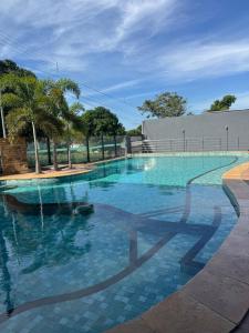 a large swimming pool with blue water at HOTEL TERRA NATIVA in Alter do Chao