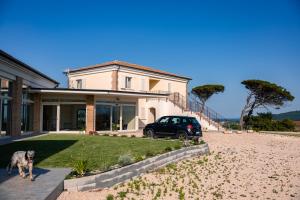 a dog standing in front of a house at Vigne Marrone B&B in Fossacesia