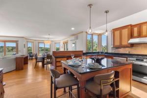a kitchen with a large island in the middle at Waterfront Escape Game Room Dog Friendly in Chatham