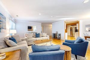 a living room with two couches and a table at The Nest in Ocean Pines +31 photos