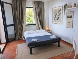 a bedroom with a bed and a window at Il Corbezzolo Tropea Residence in Tropea +107 photos