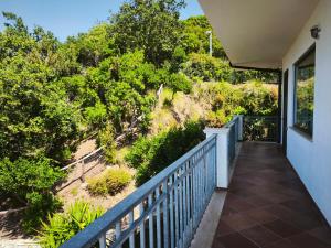 a balcony with a view of a hill at Il Corbezzolo Tropea Residence in Tropea
