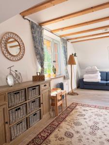 a living room with a table and a mirror at Dom Prowansalski in Jaworzynka +23 photos