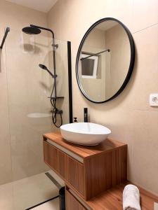 a bathroom with a sink and a mirror at Šaravanja in Bibinje +16 photos