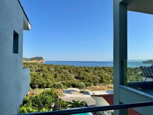 a view of the ocean from a balcony at Siblings by the Sea in Skala Marion