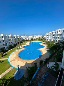 an image of a swimming pool at a apartment at Jawhara smir 2ET vue piscine in M'diq +18 photos
