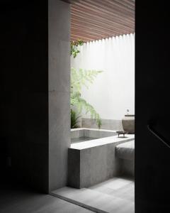 a bathroom with a large window and a sink at Nima Local House Hotel & Spa in Mexico City +64 photos