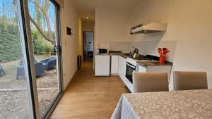 a kitchen with a stove and a counter top at Container home in San Rafael