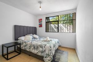 a bedroom with a bed and a window at Your Home in León Top Location in León