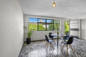 a room with a table and chairs and a window at Your Home in León Top Location in León