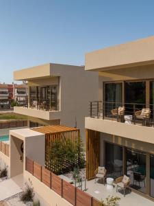 an image of a house with a balcony at IONE Suites in Preveza