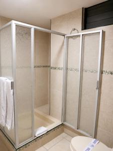 a bathroom with a shower and a toilet at Hotel Santa Rosa in Arequipa +63 photos