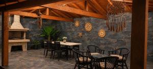 a dining room with a table and chairs and a fireplace at Harmony apartment near Dassia, Ipsos in Ipsos