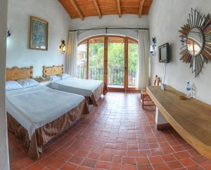 Postel nebo postele na pokoji v ubytování Guerrero Misión Hotel Concepto + 49 fotografií