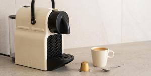 a coffee maker and a cup of coffee on a counter at Harmony apartment near Dassia, Ipsos in Ipsos