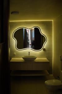 a bathroom with a sink and a mirror at Valea Bhurban in Bhurban +11 photos