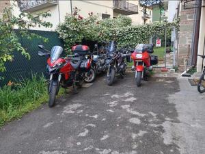 a row of motorcycles parked next to a building at Il Campanile di Arezzo in Arezzo