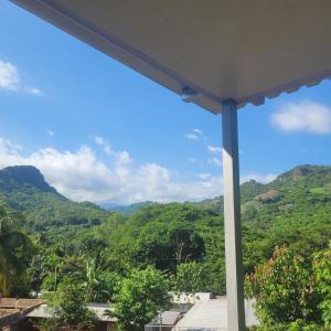 a view of the mountains from a house at Torogoz Apartment km61 5 in Jicalapa +2 photos