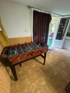 a foosball table in the middle of a room at Manna Igal Apartman in Igal