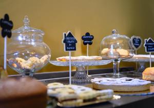 a display of cookies and pastries on a table at B&B Locanda Cistercense in San Martino al Cimino