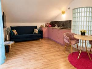 a living room with a couch and a table at Apartament Premium Cichowo in Cichowo +46 photos
