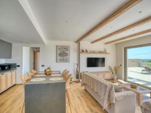 a kitchen and living room with a table and chairs at Villa Dioni in Kardamaina