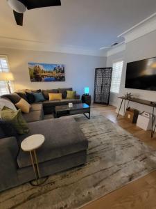 a living room with a couch and a table at Terrace On Main Street in Murphys