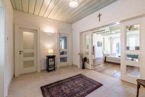 a living room with a cross on the ceiling at Villa Avola Bol Exclusive Beach Access in Bol +102 photos