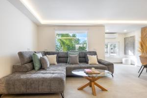 a living room with a couch and a table at Villa Cobo in Torremolinos
