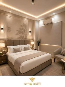 a hotel room with a large bed and a chair at Lotus Apartments l New Cairo in Cairo