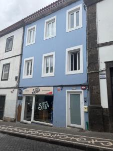 a blue building on the side of a street at Ripado Loft in Ponta Delgada