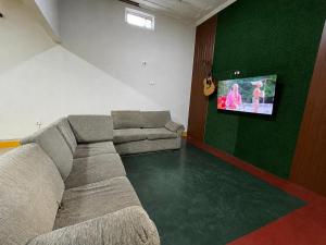 A television and/or entertainment centre at The Grindio Hostel