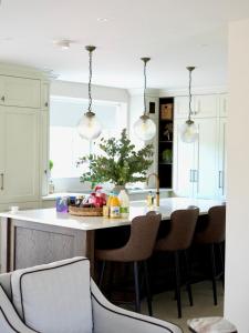 a kitchen with a island with a basket of food on it at Carland Cottage in Carland