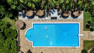an overhead view of a blue swimming pool at Emesh Boutique Suite in Agrigento
