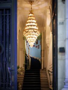 a large chandelier hanging from a hallway with stairs at Mr Cas Hotels Taksim - Special Category in Istanbul