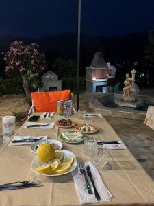 a table with plates of food on top at Villa RESA - Intero allogio in Orikum