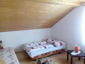 A bed or beds in a room at Ubytovanie Hugo Alžbetka