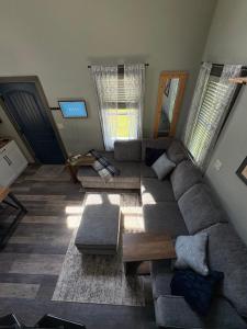 a living room with a couch and a table at The Perfect Match River Retreat in Buffalo City