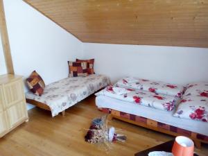 A bed or beds in a room at Ubytovanie Hugo Alžbetka