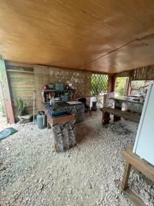 a living room with a table and a table at FARE Tatahi in Parea +13 photos
