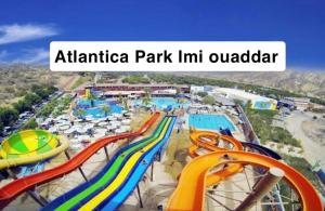 an amusement park with a water park with a slide at Nour House Imi Ouaddar in Agadir nʼ Aït Sa
