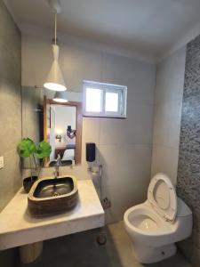 a bathroom with a sink and a toilet at The Crib, Murree Hills in Lower Topa +50 photos